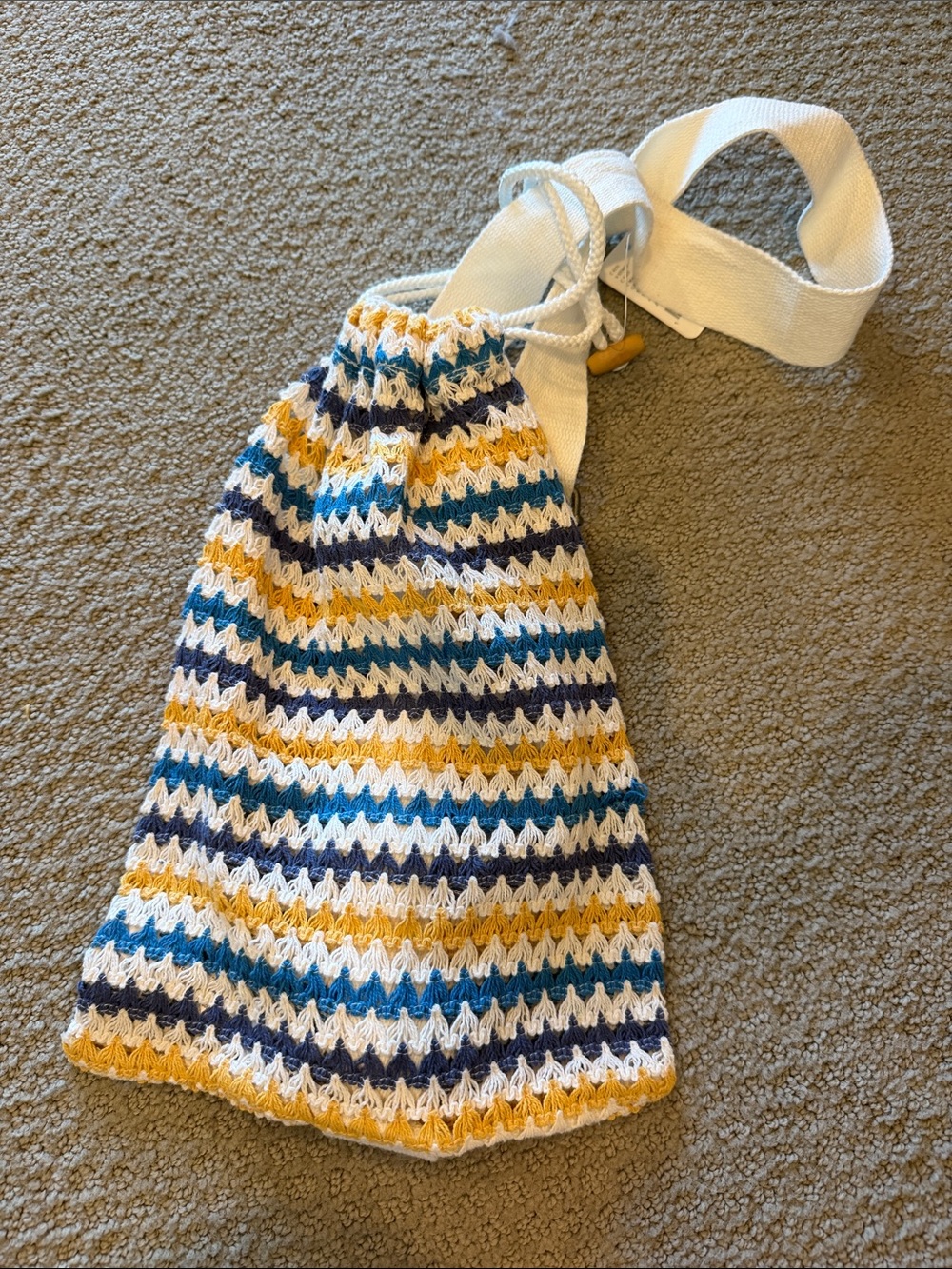 Free People Crochet Drawstring Crossbody Bag in White, Yellow & Blue